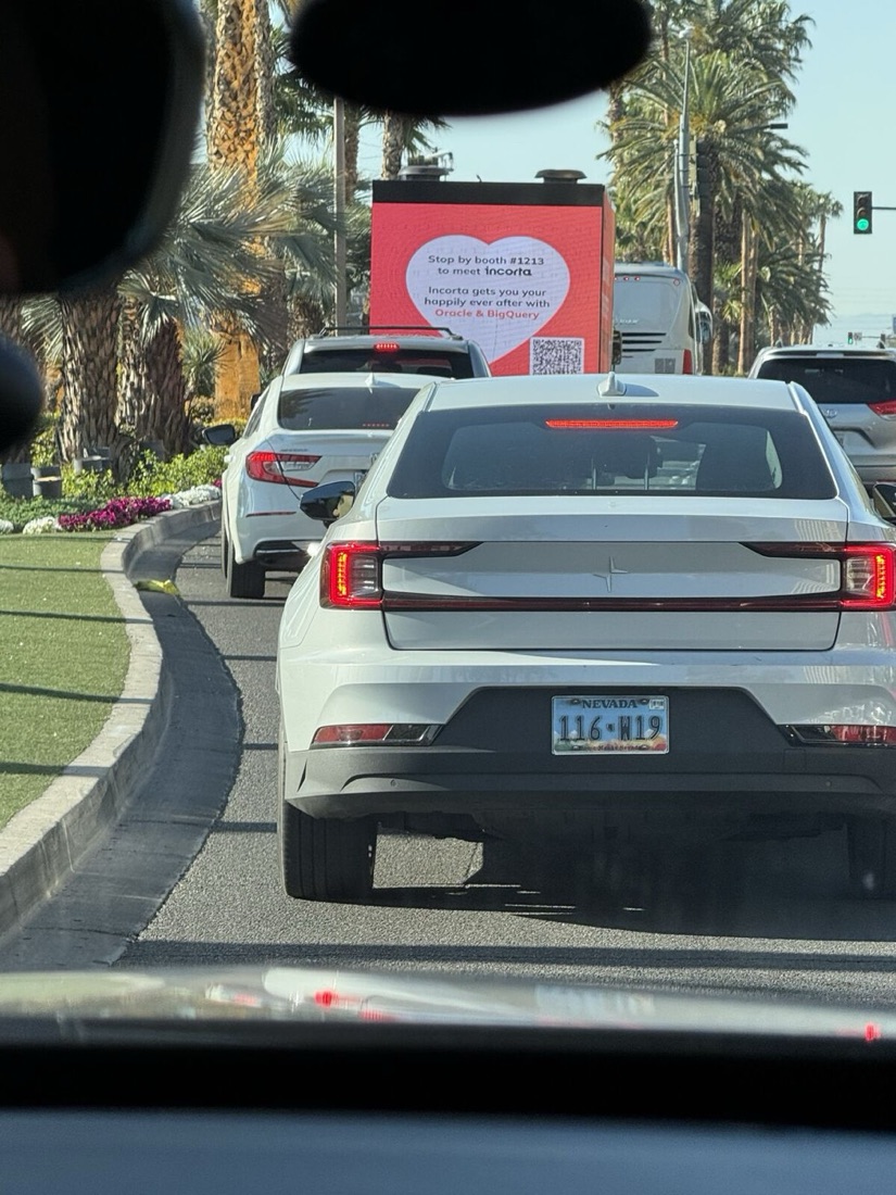 Digital LED billboard truck driving in traffic on a Las Vegas street running a live brand campaign